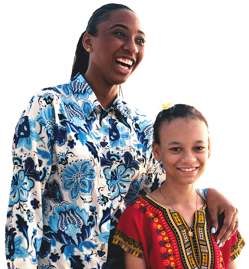 Young woman facing to the right smiling with hand on the shoulder of girl